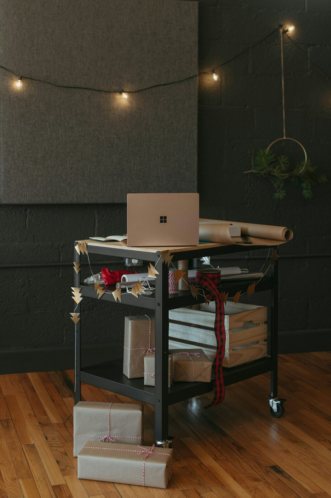 Desk with a laptop, notebook and film rolls