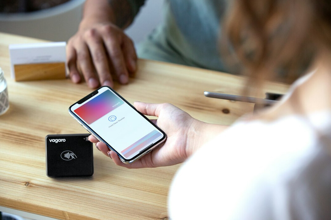 Two people talking with a voice recorder on the table